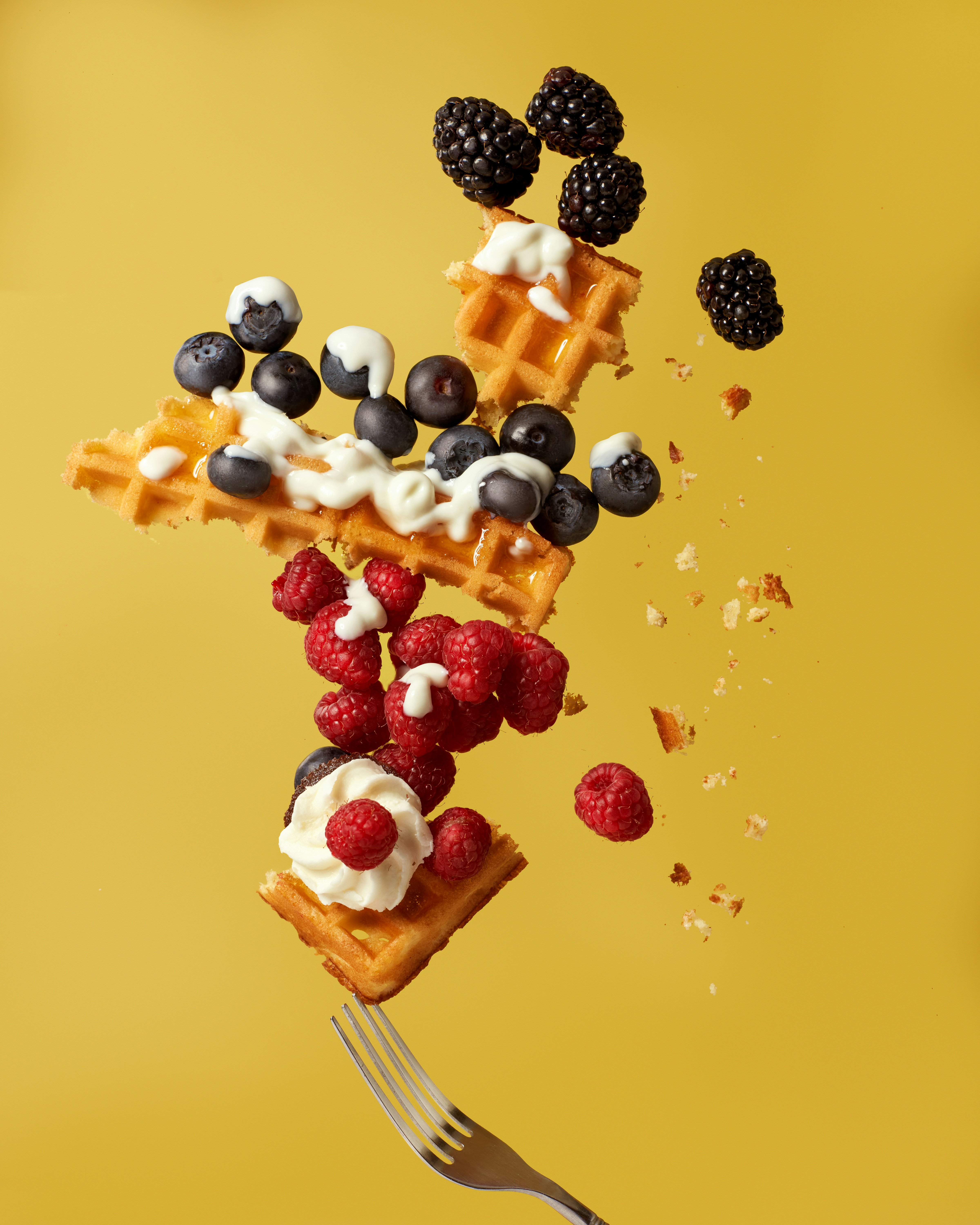 white and red fruit on brown wooden stick